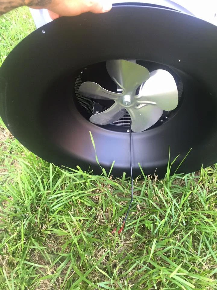 View of the fan blades underneath the attic fan housing